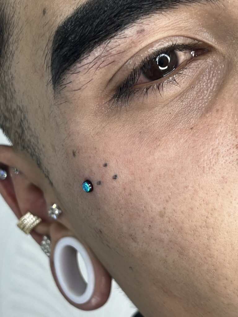 Microdermal piercing Camilo Barreto